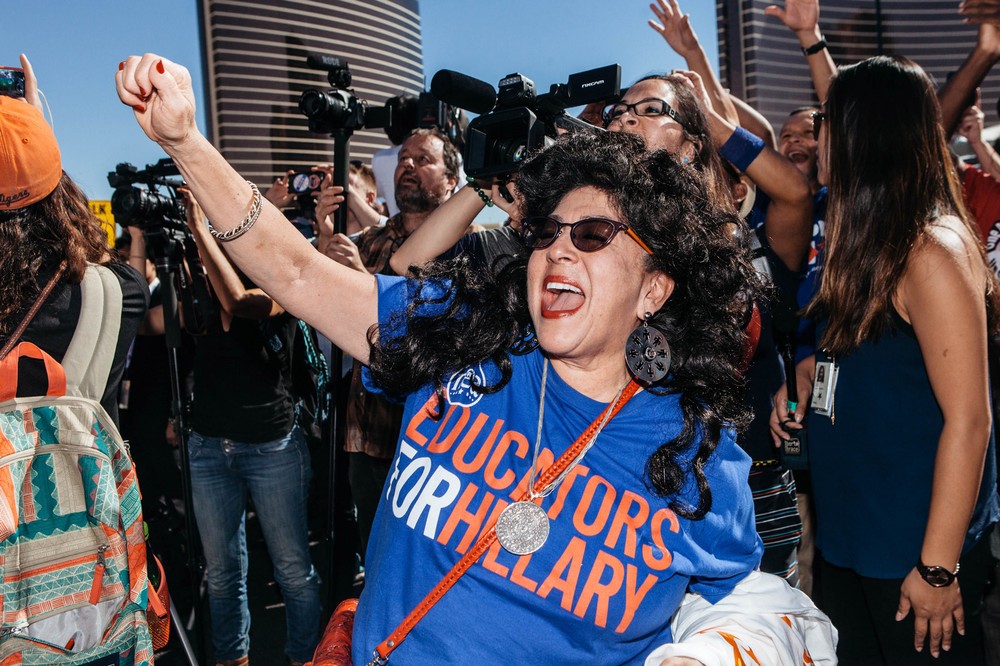 Lind Cabral cheers during a protest by the Culinary Union which built a 