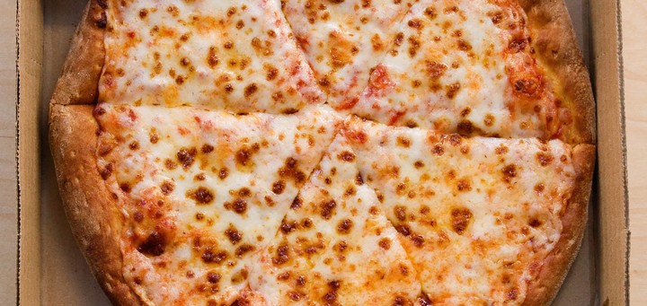 The Way You Eat Pizza Says a Lot About You, According to